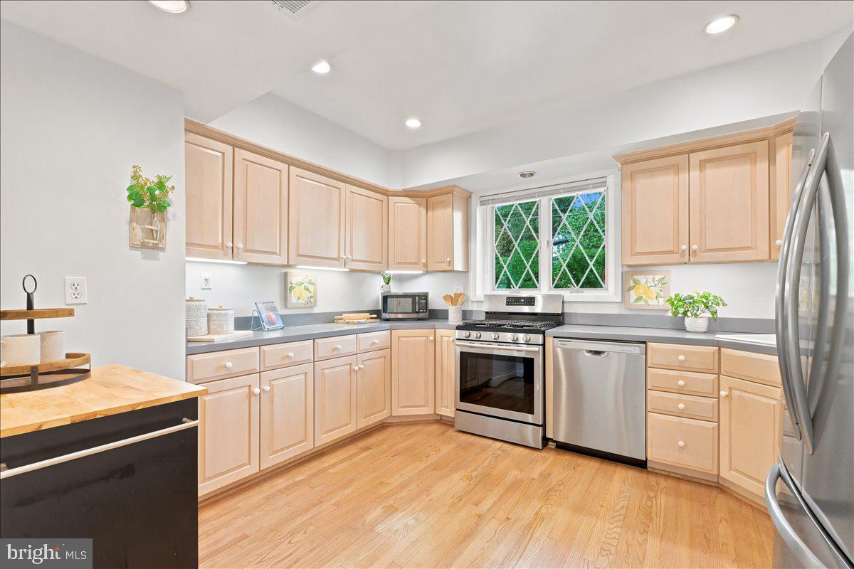 2800 South Arlington Ridge Road Arlington, VA 22206 - Photo 15 of 54 a kitchen with stainless steel appliances granite countertop a stove a sink dishwasher and a refrigerator