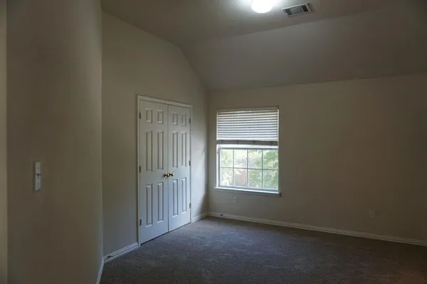 a view of a livingroom with a chandelier fan