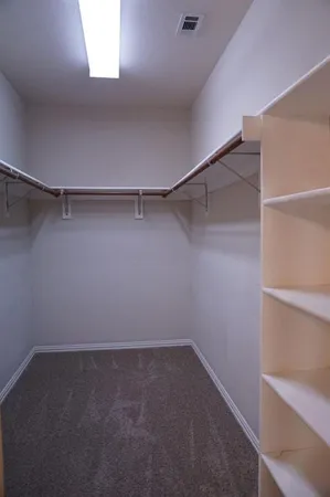 a bathroom with a sink vanity and mirror