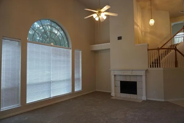 a view of empty room with fireplace