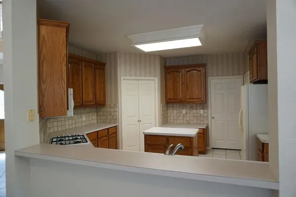 a view of a livingroom with a ceiling fan and window