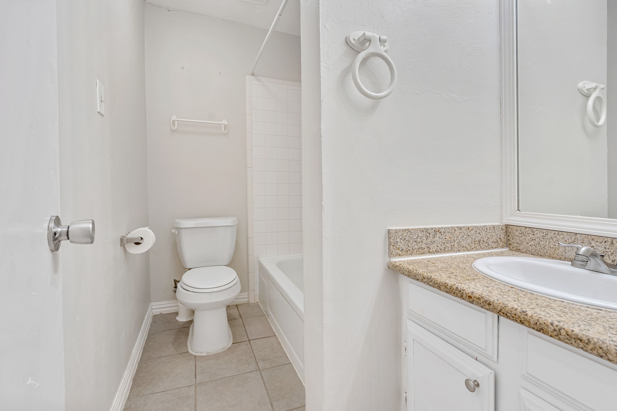 16722 Shrub Oak Drive Humble, TX 77396 - Photo 14 of 30 a bathroom with a granite countertop sink a toilet and a mirror