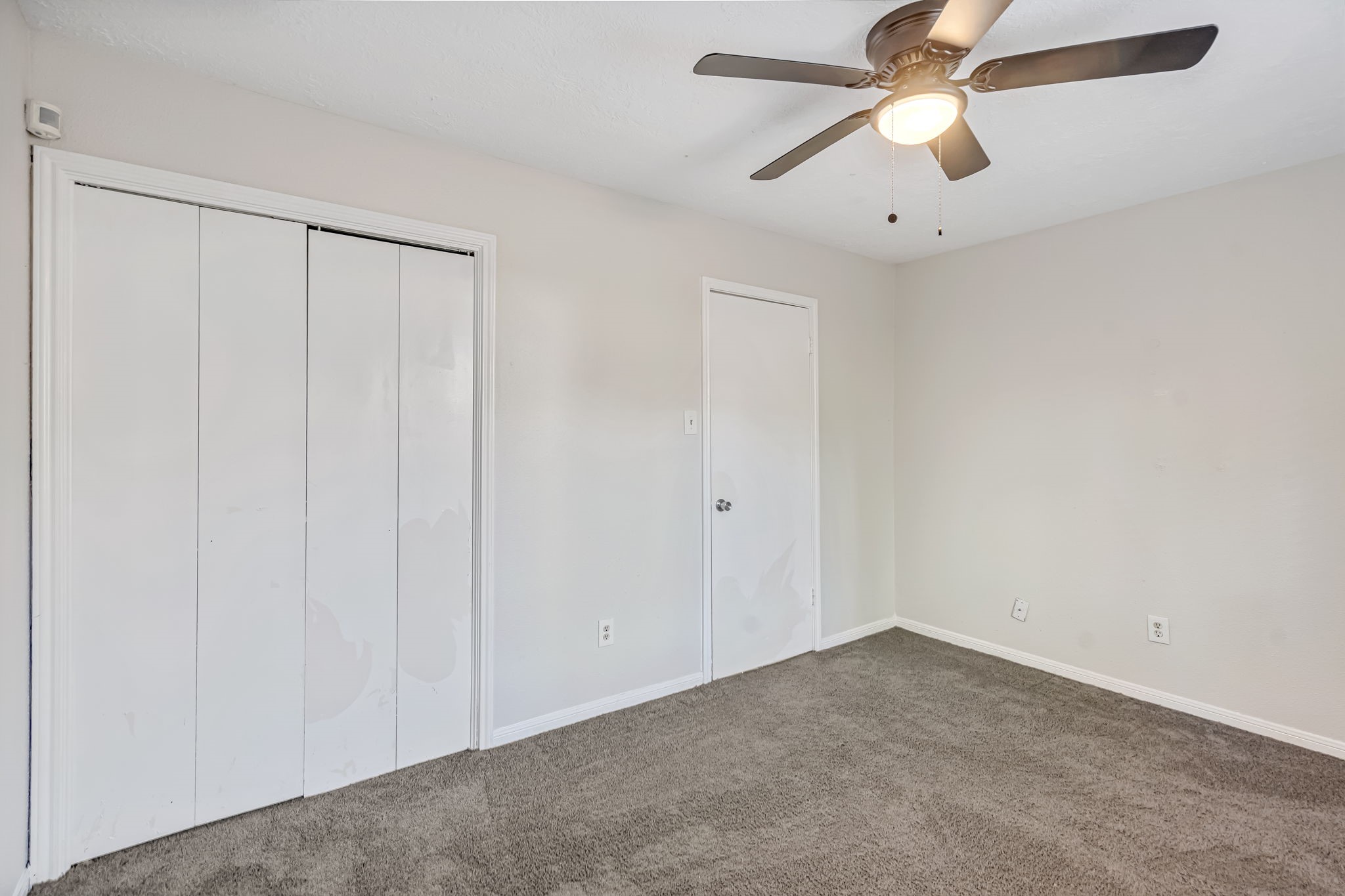 16722 Shrub Oak Drive Humble, TX 77396 - Photo 16 of 30 an empty room with a window and a fan