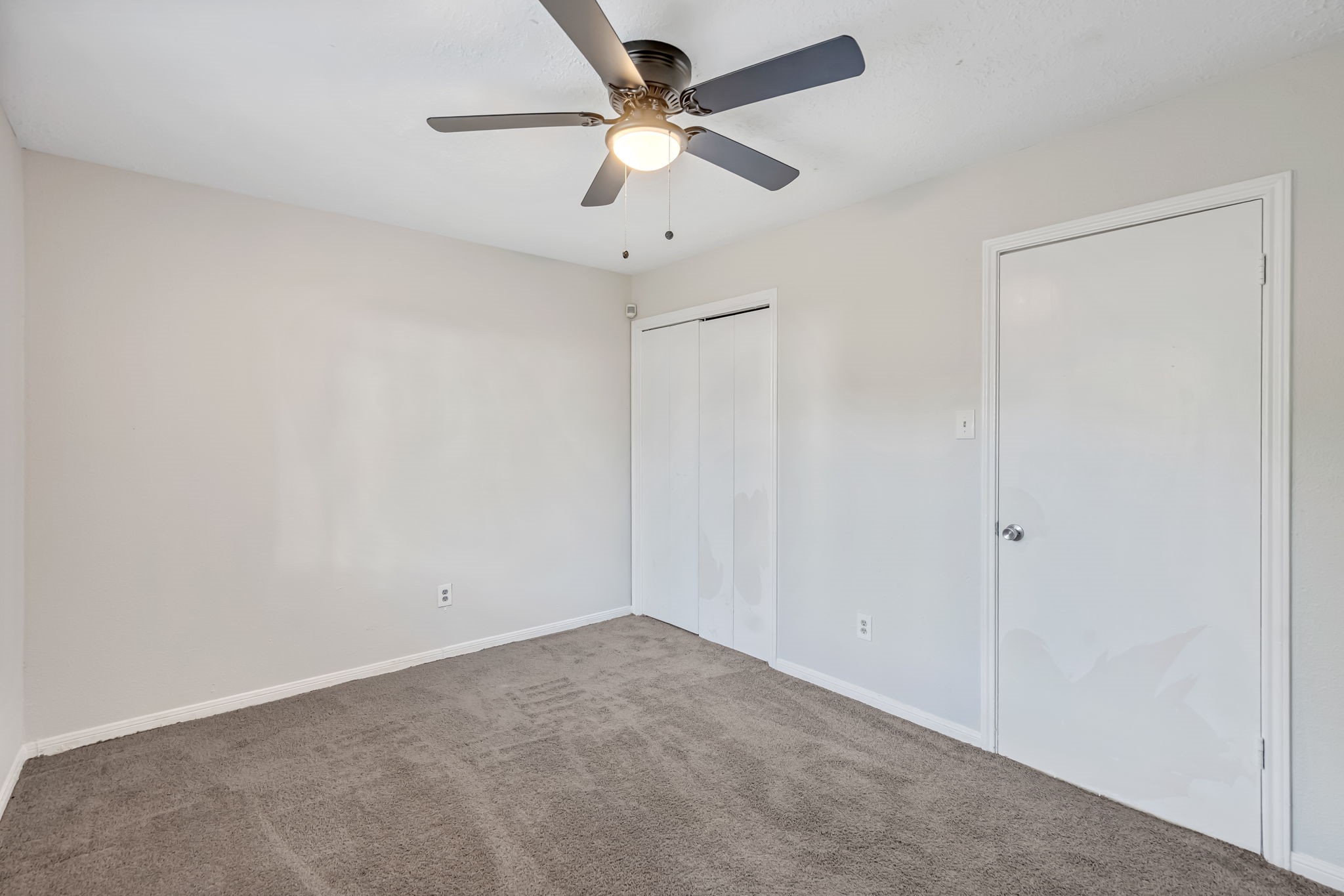16722 Shrub Oak Drive Humble, TX 77396 - Photo 18 of 30 an empty room with a ceiling fan and a fan