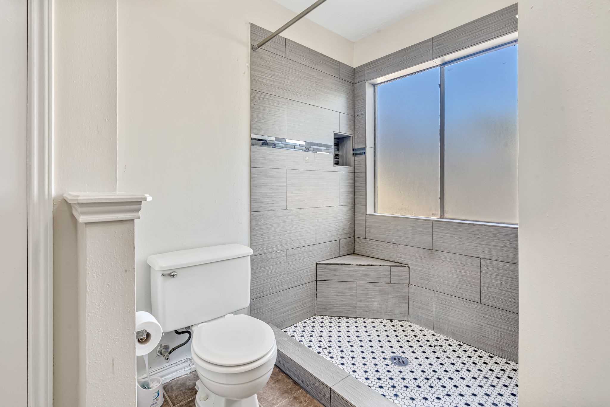 16722 Shrub Oak Drive Humble, TX 77396 - Photo 23 of 30 a bathroom with a toilet and a shower