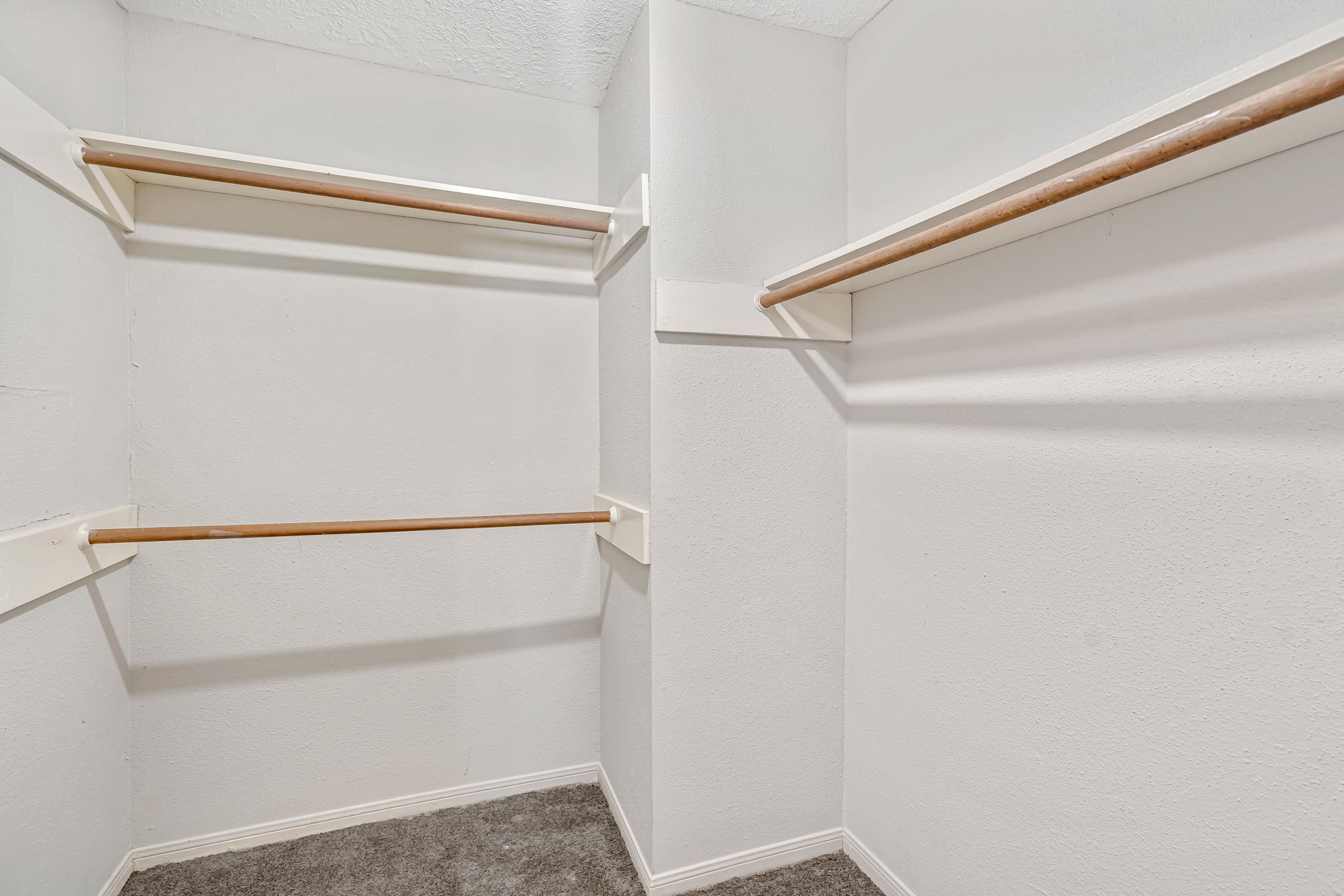 16722 Shrub Oak Drive Humble, TX 77396 - Photo 25 of 30 a view of walk in closet with empty racks
