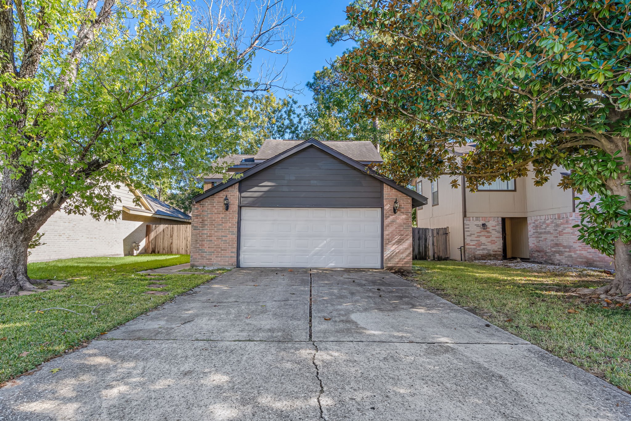 16722 Shrub Oak Drive Humble, TX 77396 - Photo 29 of 30 a front view of a house with a yard and garage