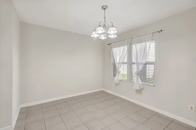 a view of a kitchen with an entryway and wooden floor