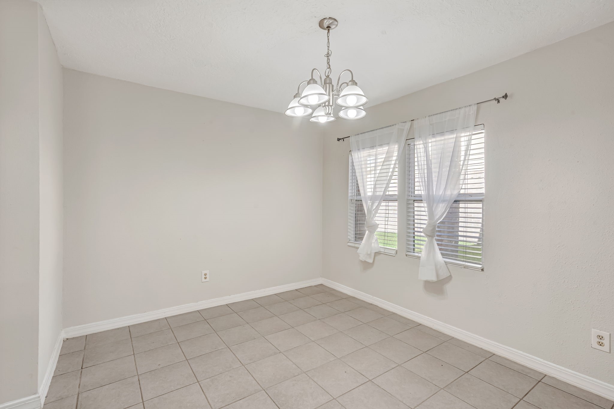 16722 Shrub Oak Drive Humble, TX 77396 - Photo 3 of 30 a view of an empty room with a window