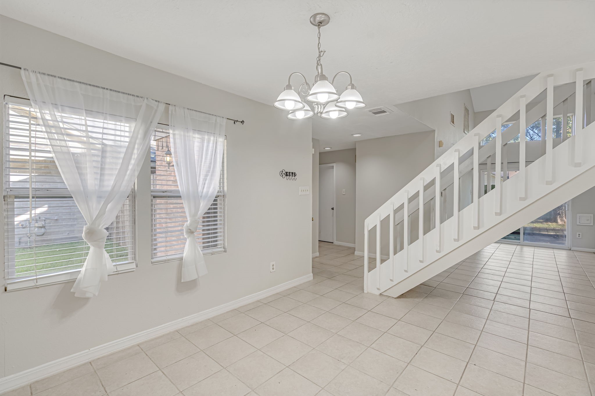 16722 Shrub Oak Drive Humble, TX 77396 - Photo 5 of 30 a view of an empty room with a window