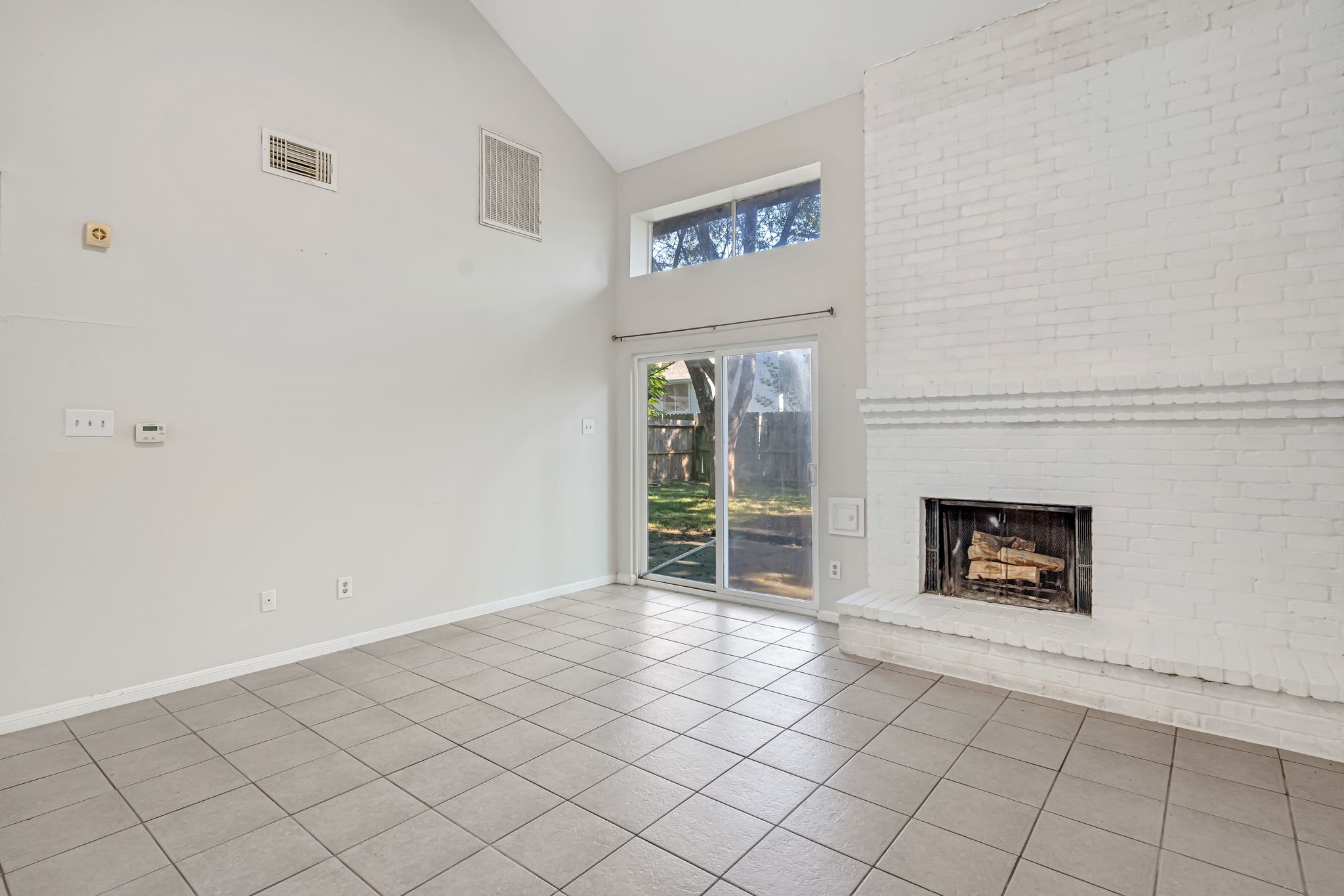 16722 Shrub Oak Drive Humble, TX 77396 - Photo 10 of 30 a view of an empty room with window and fire place
