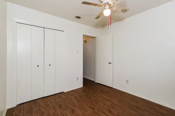a view of an entryway with wooden floor