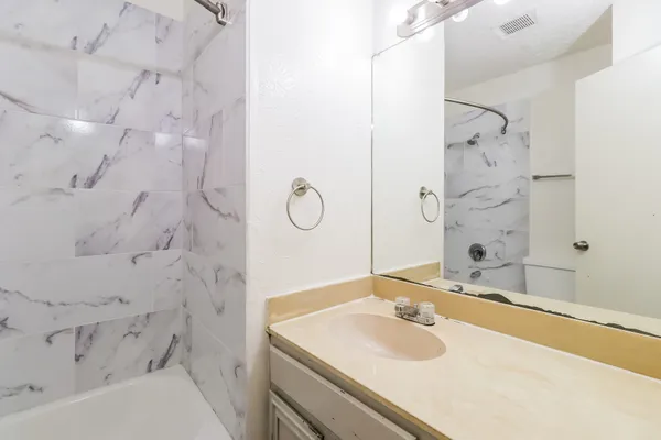 a bathroom with a sink and a bathtub