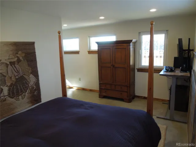 a bedroom with a bed and a walk in closet