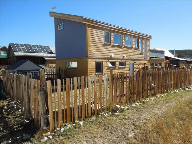 a front view of a house with parking space