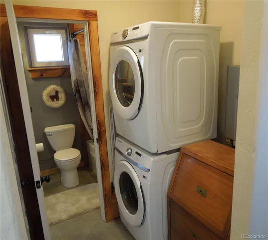 a bathroom with a toilet and a sink