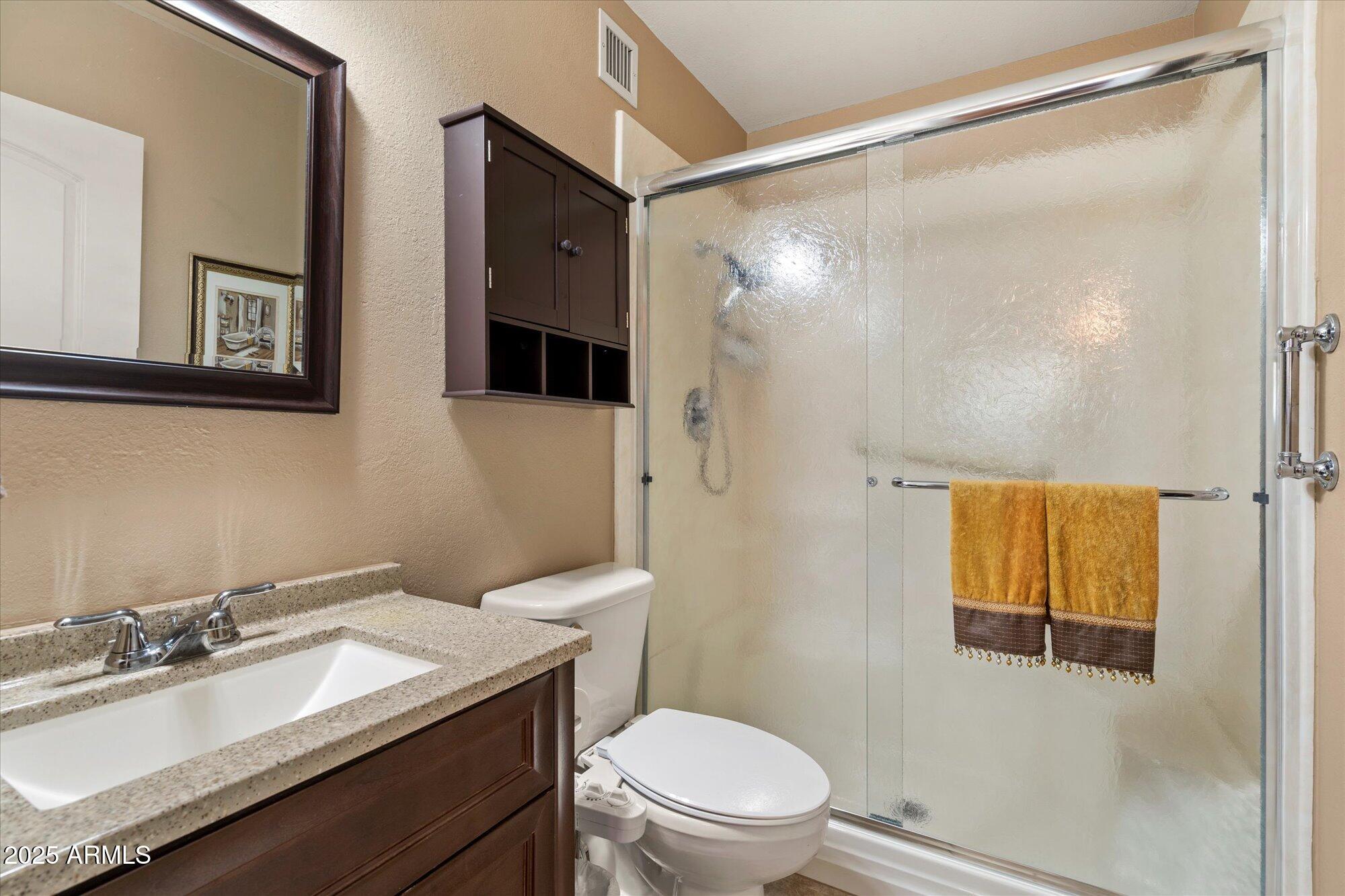 9666 West Mountain View Road, Unit A Peoria, AZ 85345 - Photo 11 of 22 Primary Bathroom with Walk-In Shower