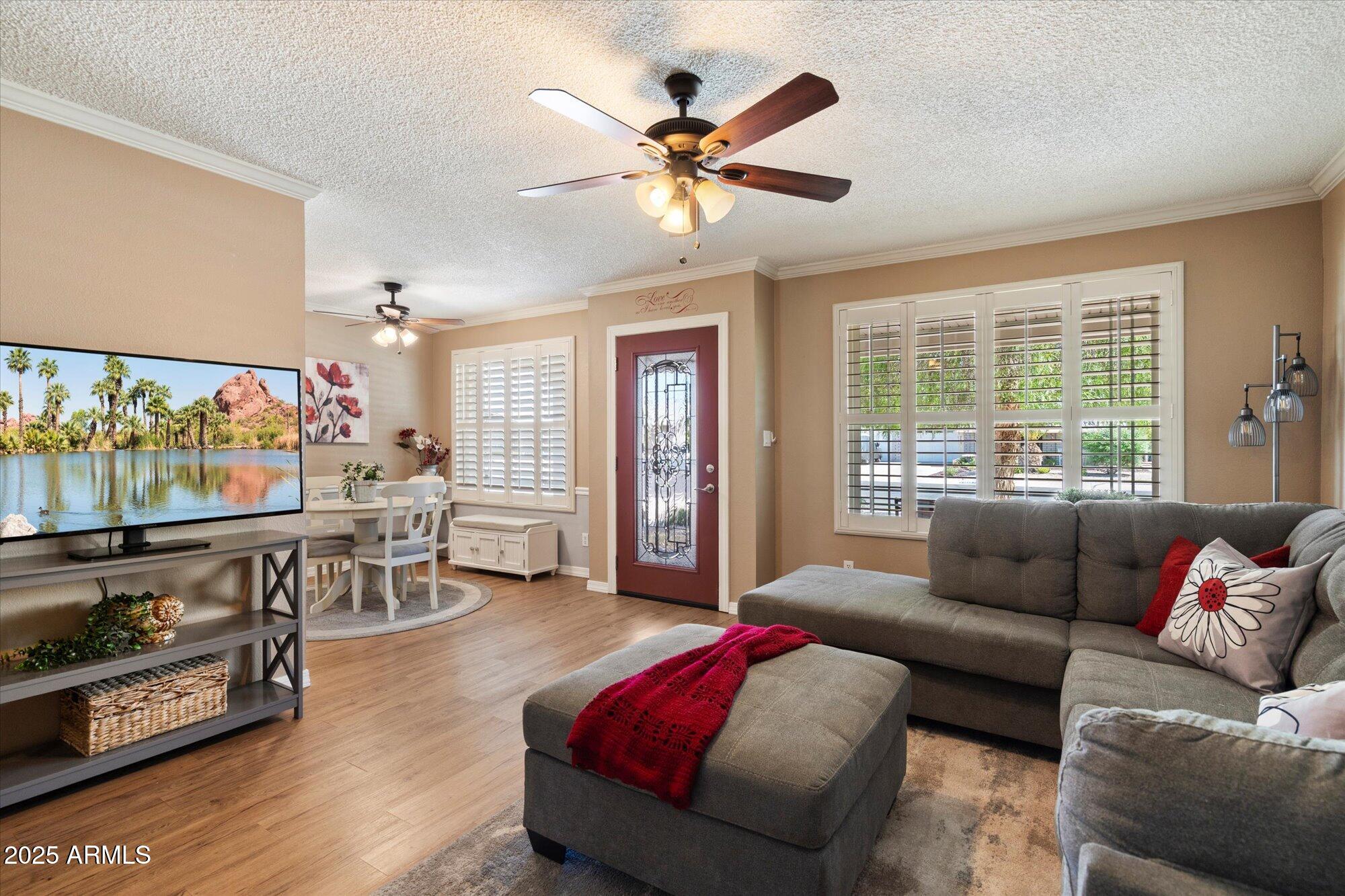 9666 West Mountain View Road, Unit A Peoria, AZ 85345 - Photo 3 of 22 Living Room with Plantation Shutters