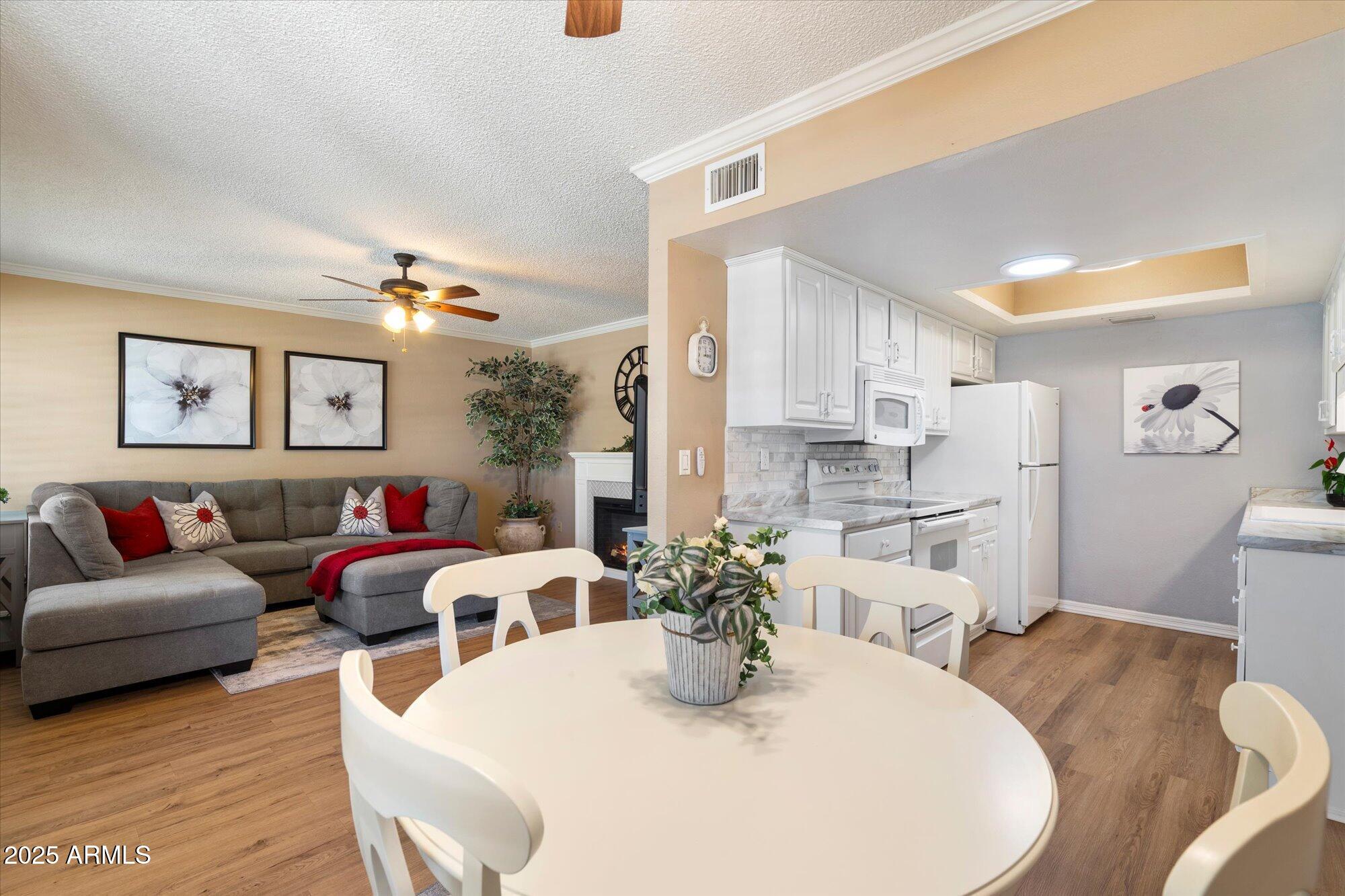 9666 West Mountain View Road, Unit A Peoria, AZ 85345 - Photo 5 of 22 Dining, Kitchen + Living Room