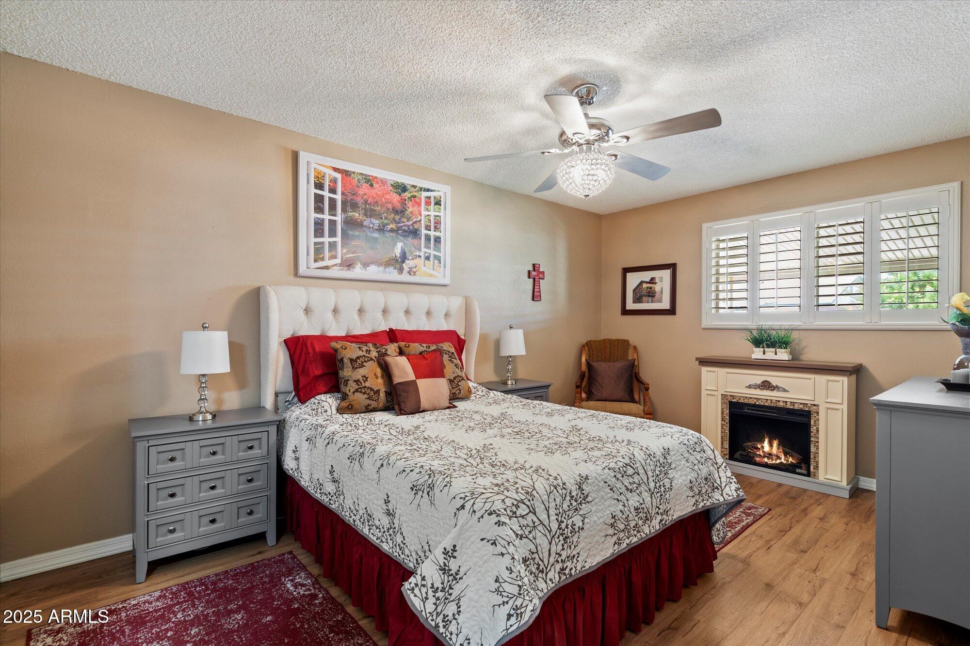 9666 West Mountain View Road, Unit A Peoria, AZ 85345 - Photo 9 of 22 Primary Bedroom, Electric Fireplace