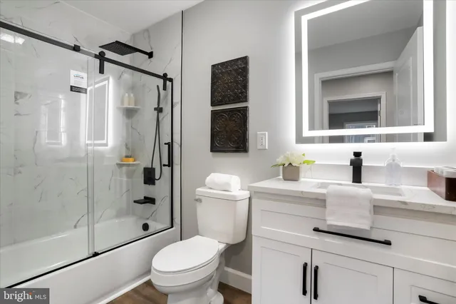 a bedroom with a bed and a chair