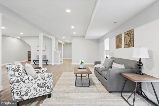 a bedroom with a bed couch and window