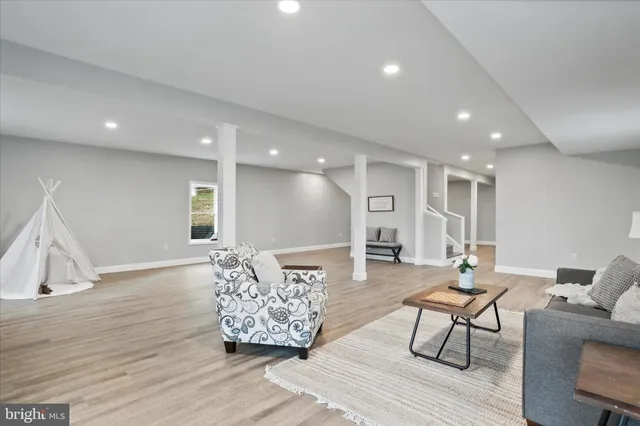 a living room with furniture and a table