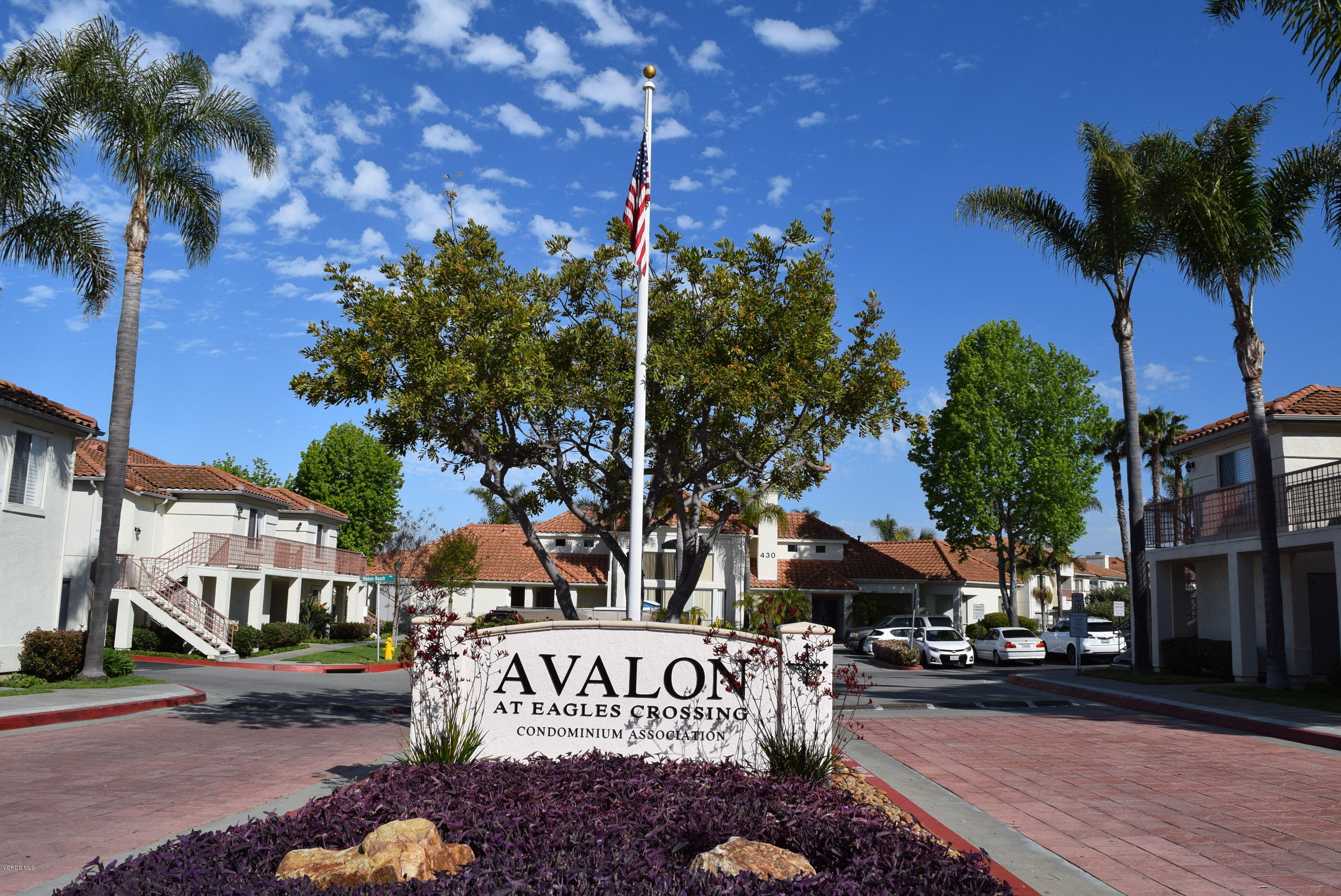 540 Ribbon Beach Way, Unit 296 Oceanside, CA 92058 - Photo 2 of 28 a sign board with a tree in the background