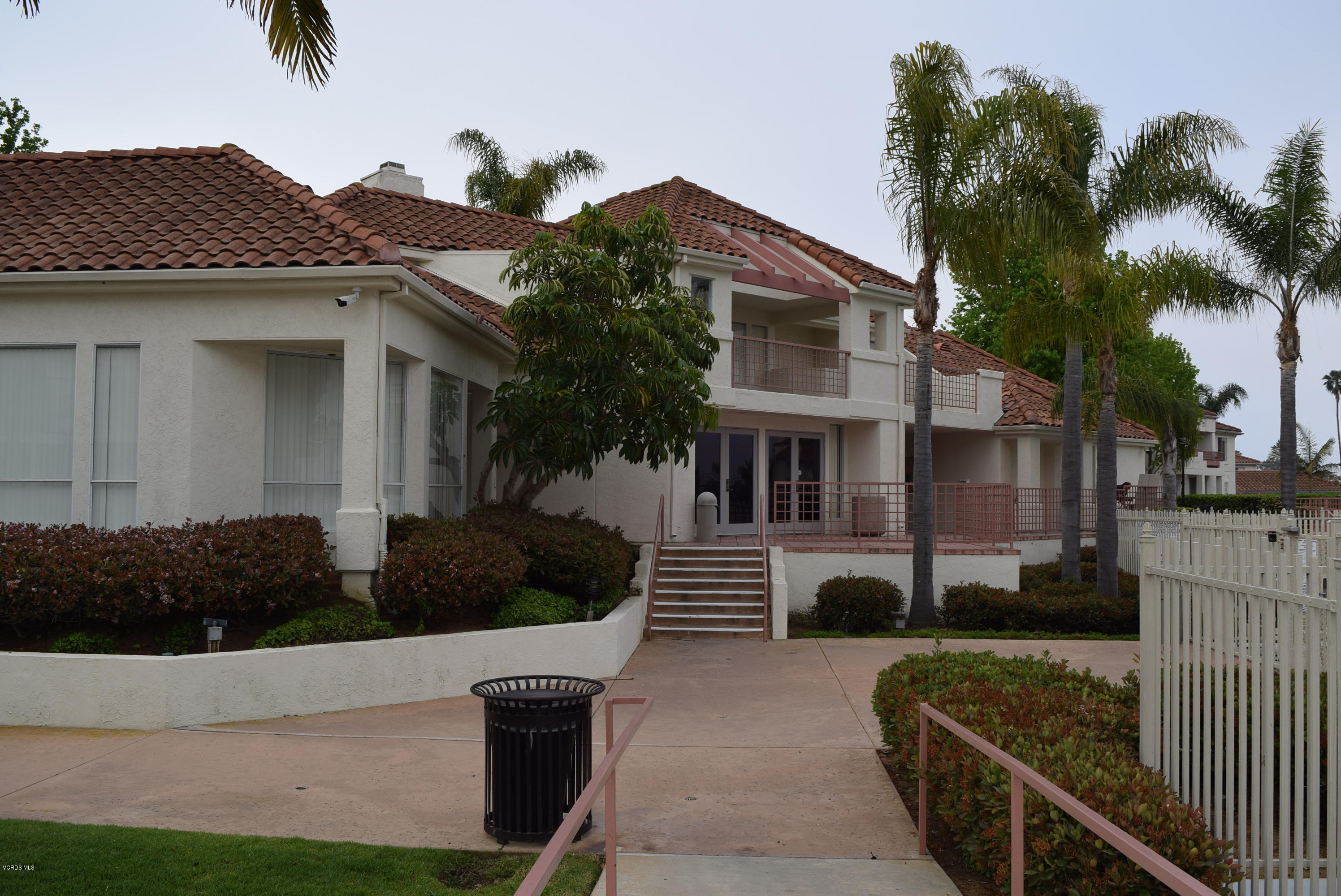 540 Ribbon Beach Way, Unit 296 Oceanside, CA 92058 - Photo 13 of 28 a front view of a house with garden