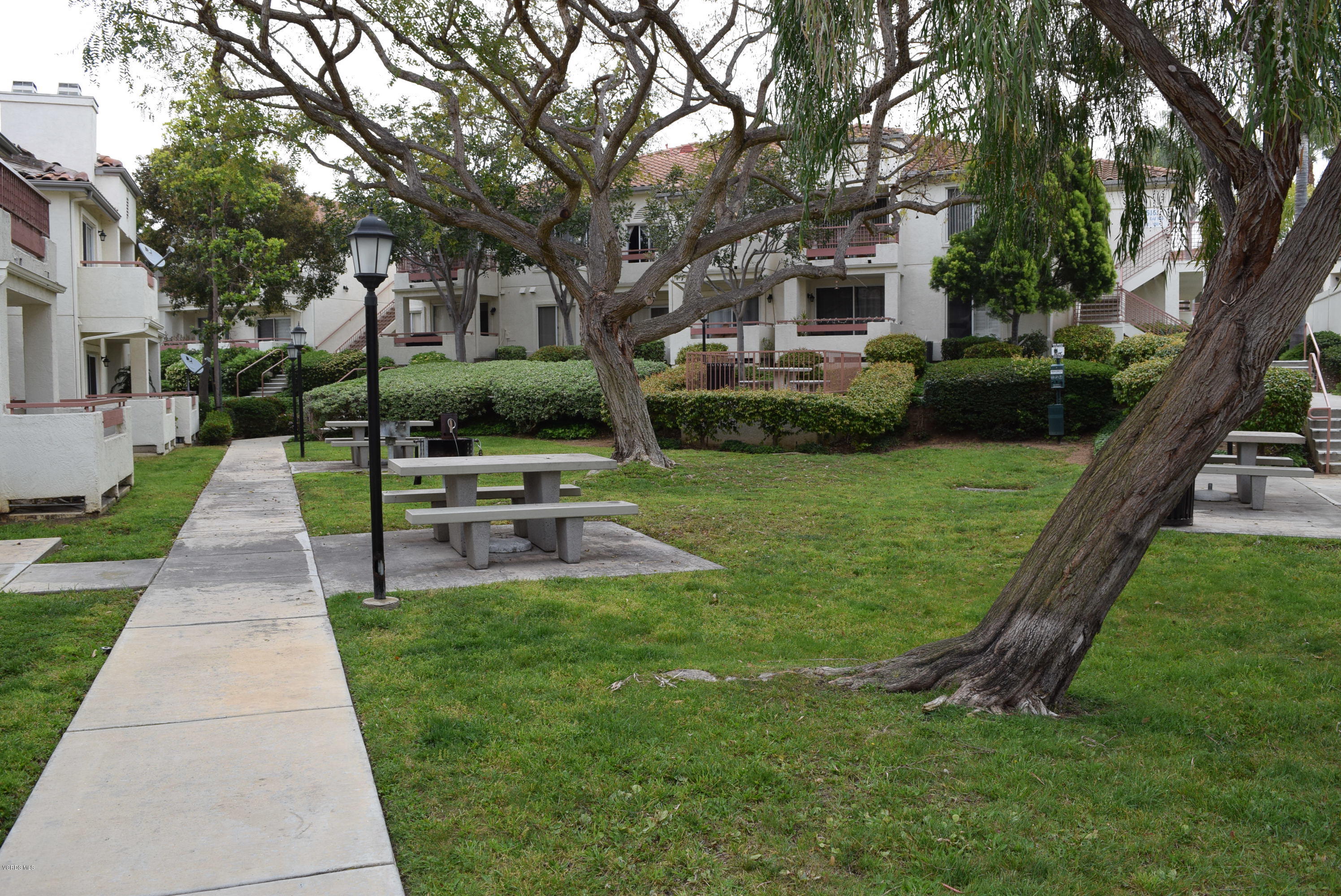 540 Ribbon Beach Way, Unit 296 Oceanside, CA 92058 - Photo 14 of 28 a front view of a house with a yard