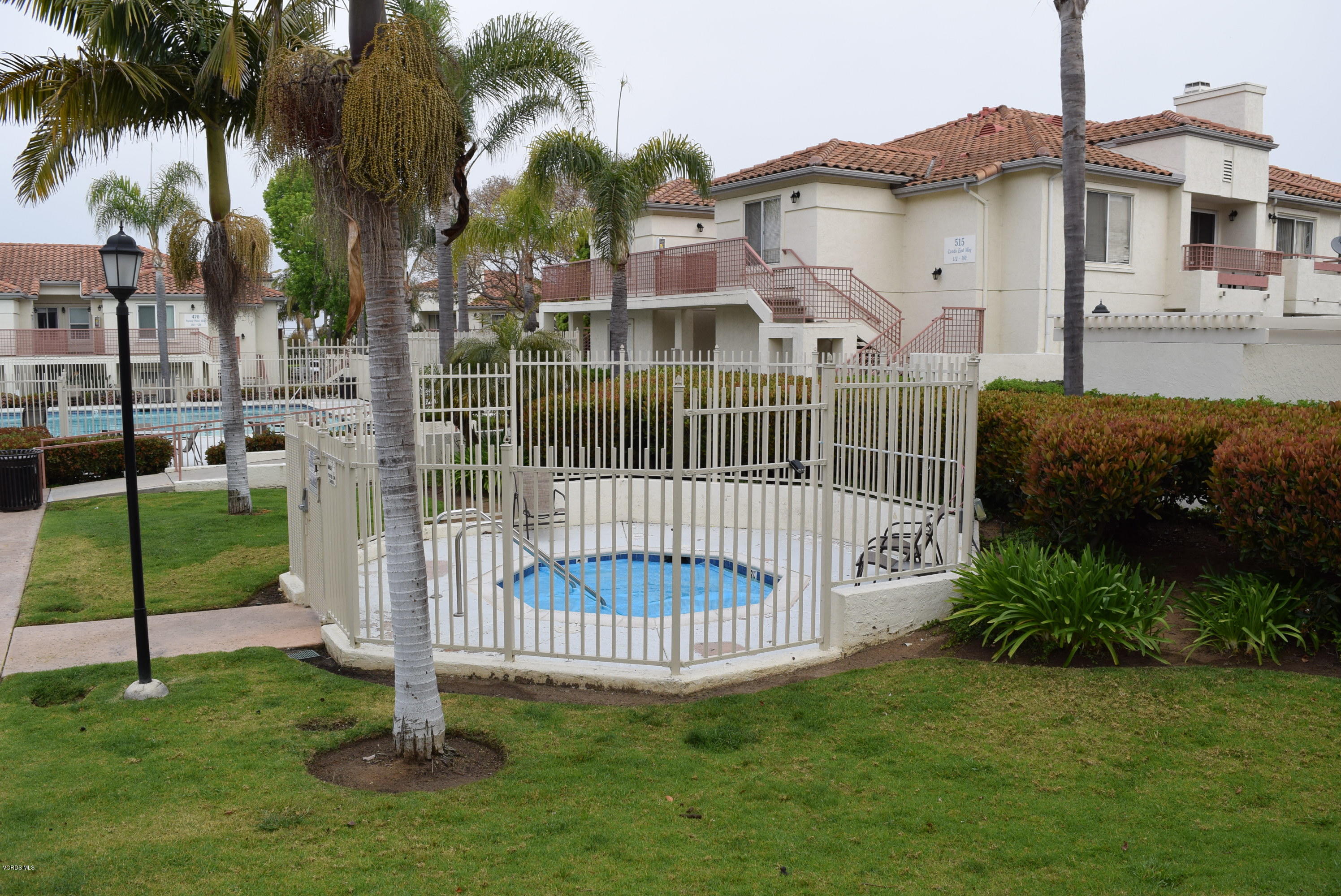 540 Ribbon Beach Way, Unit 296 Oceanside, CA 92058 - Photo 17 of 28 a front view of a house with a garden