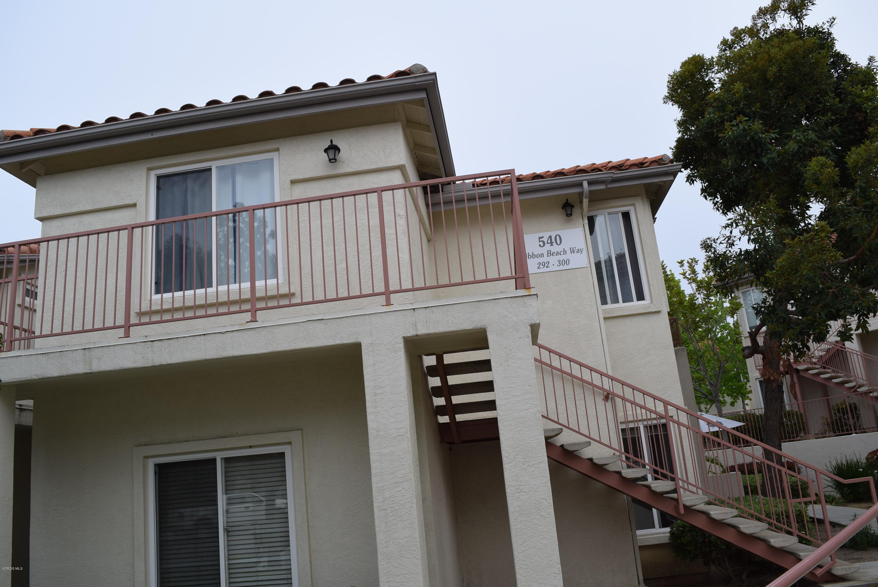 540 Ribbon Beach Way, Unit 296 Oceanside, CA 92058 - Photo 3 of 28 a view of outdoor house with a window and wooden fence