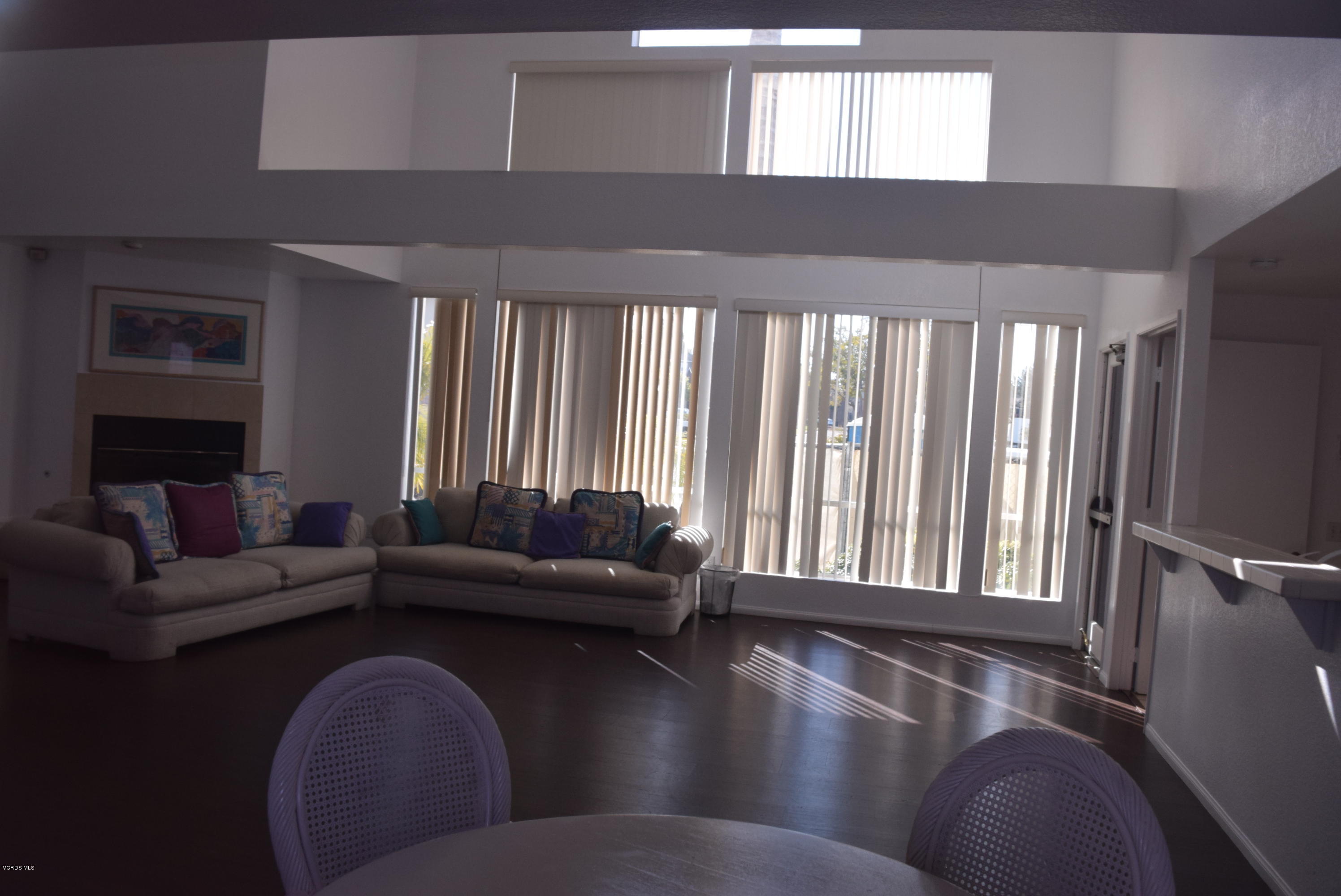 540 Ribbon Beach Way, Unit 296 Oceanside, CA 92058 - Photo 21 of 28 a living room with furniture and a fireplace