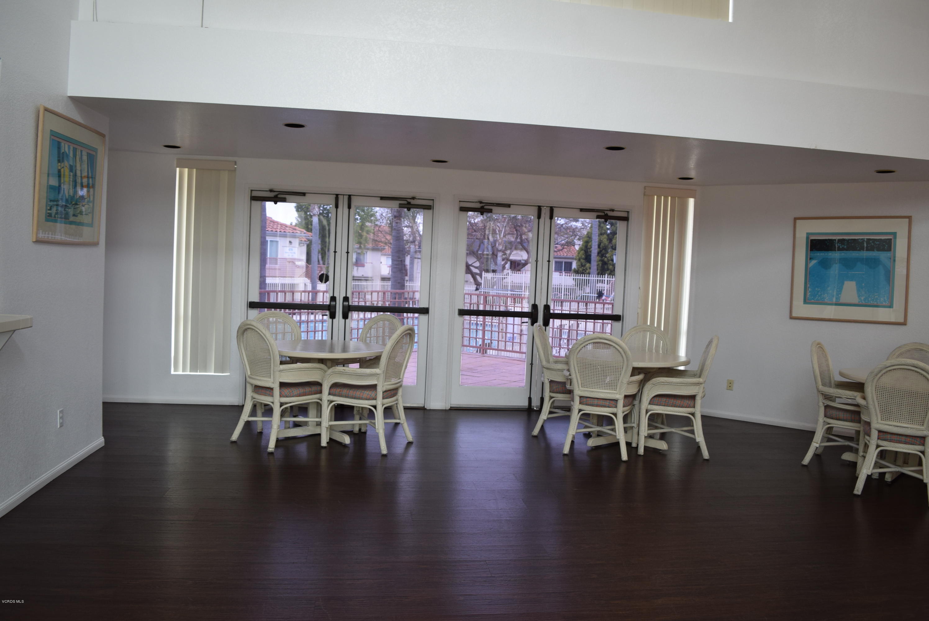 540 Ribbon Beach Way, Unit 296 Oceanside, CA 92058 - Photo 24 of 28 a dining room with furniture window and wooden floor