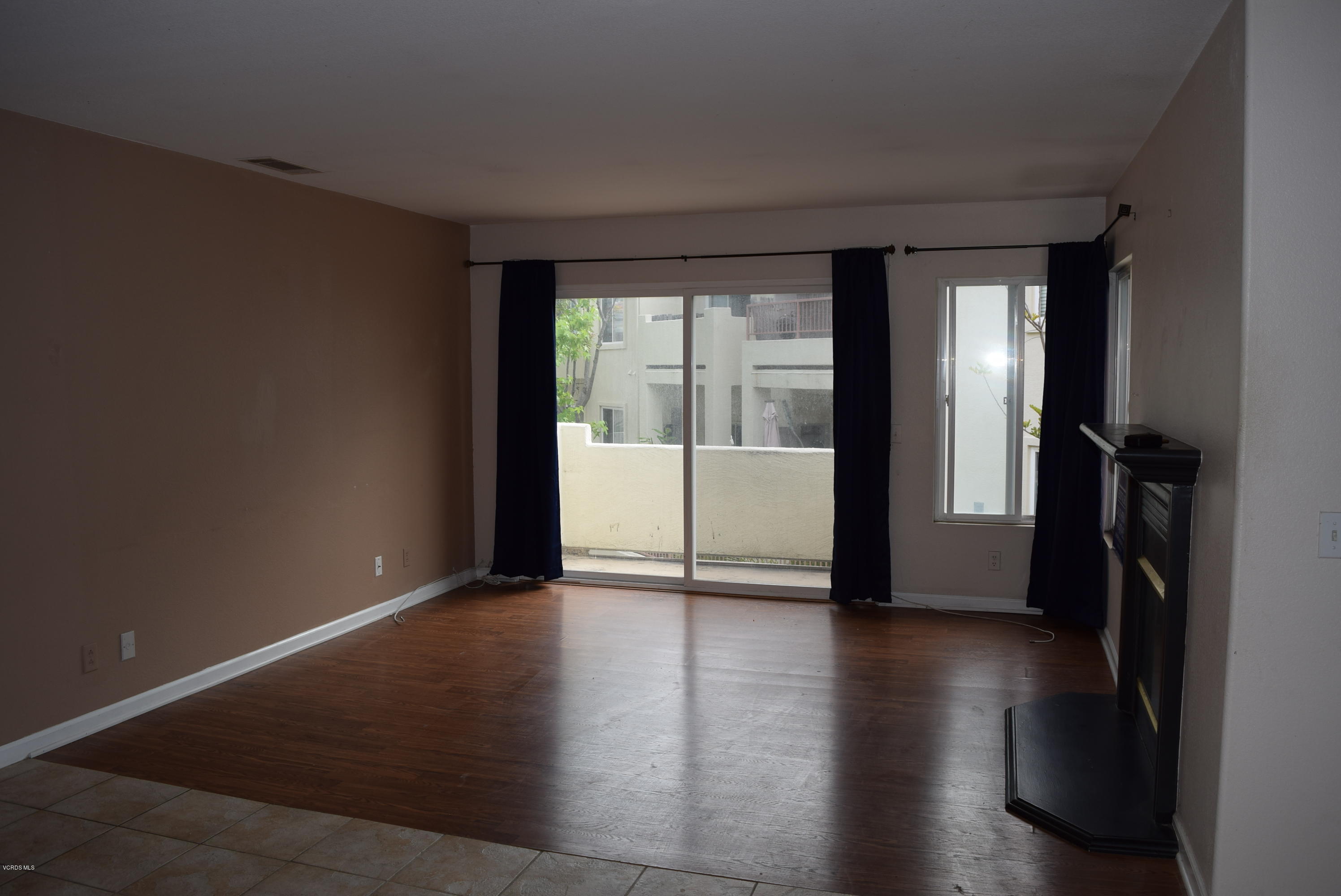 540 Ribbon Beach Way, Unit 296 Oceanside, CA 92058 - Photo 5 of 28 wooden floor in an empty room with a window