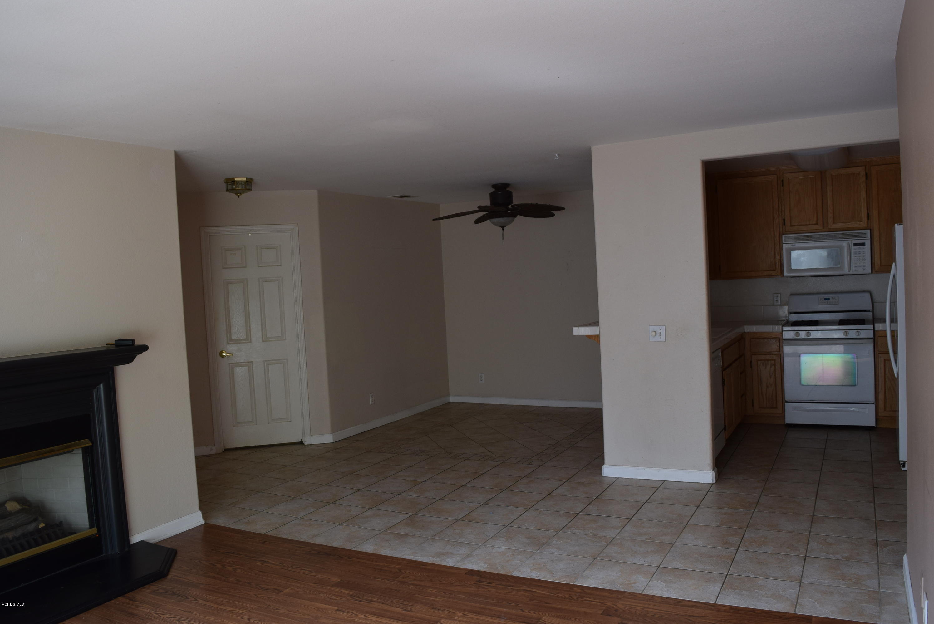 540 Ribbon Beach Way, Unit 296 Oceanside, CA 92058 - Photo 8 of 28 a view of a kitchen from the hallway with a kitchen