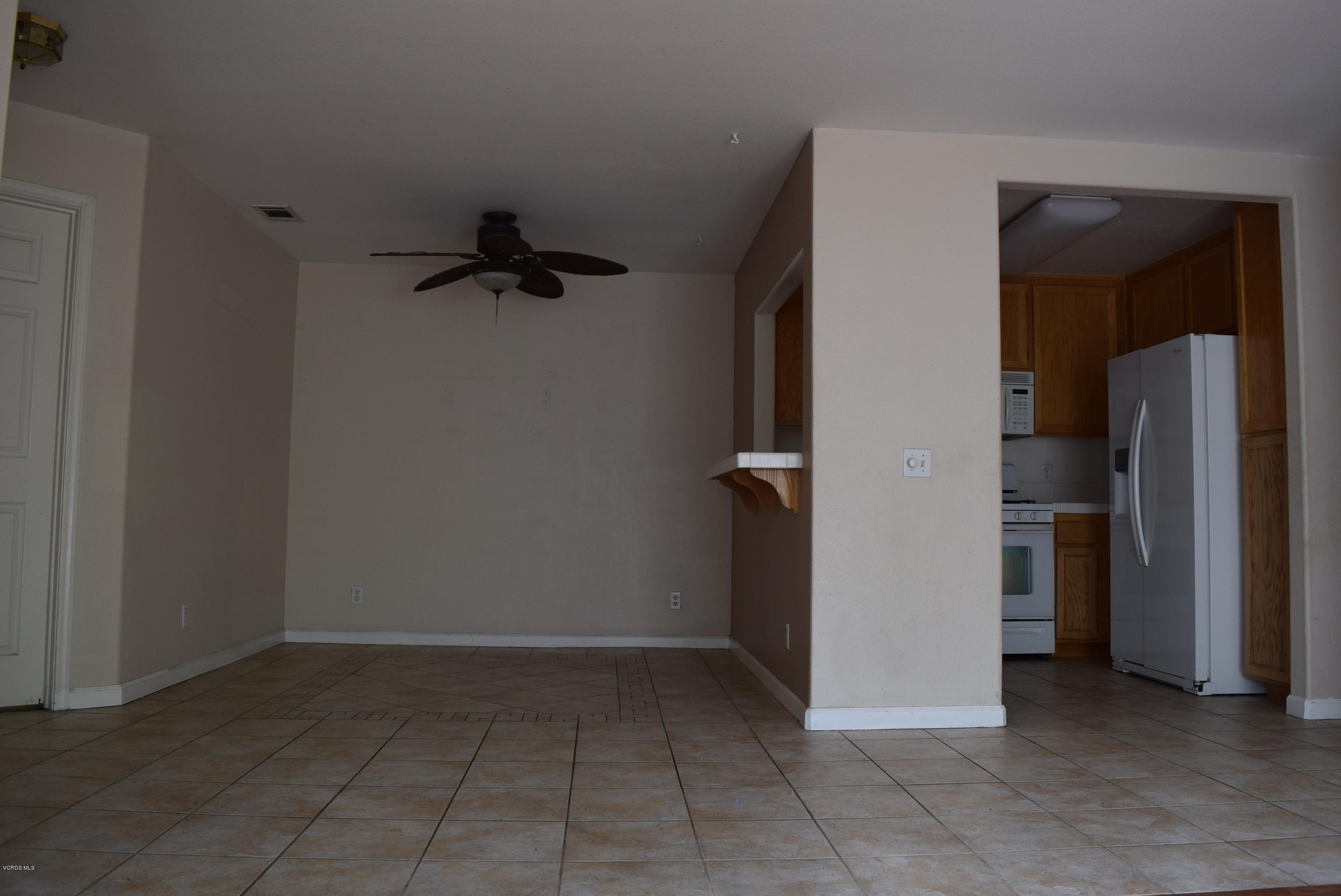 540 Ribbon Beach Way, Unit 296 Oceanside, CA 92058 - Photo 9 of 28 an empty room with a door