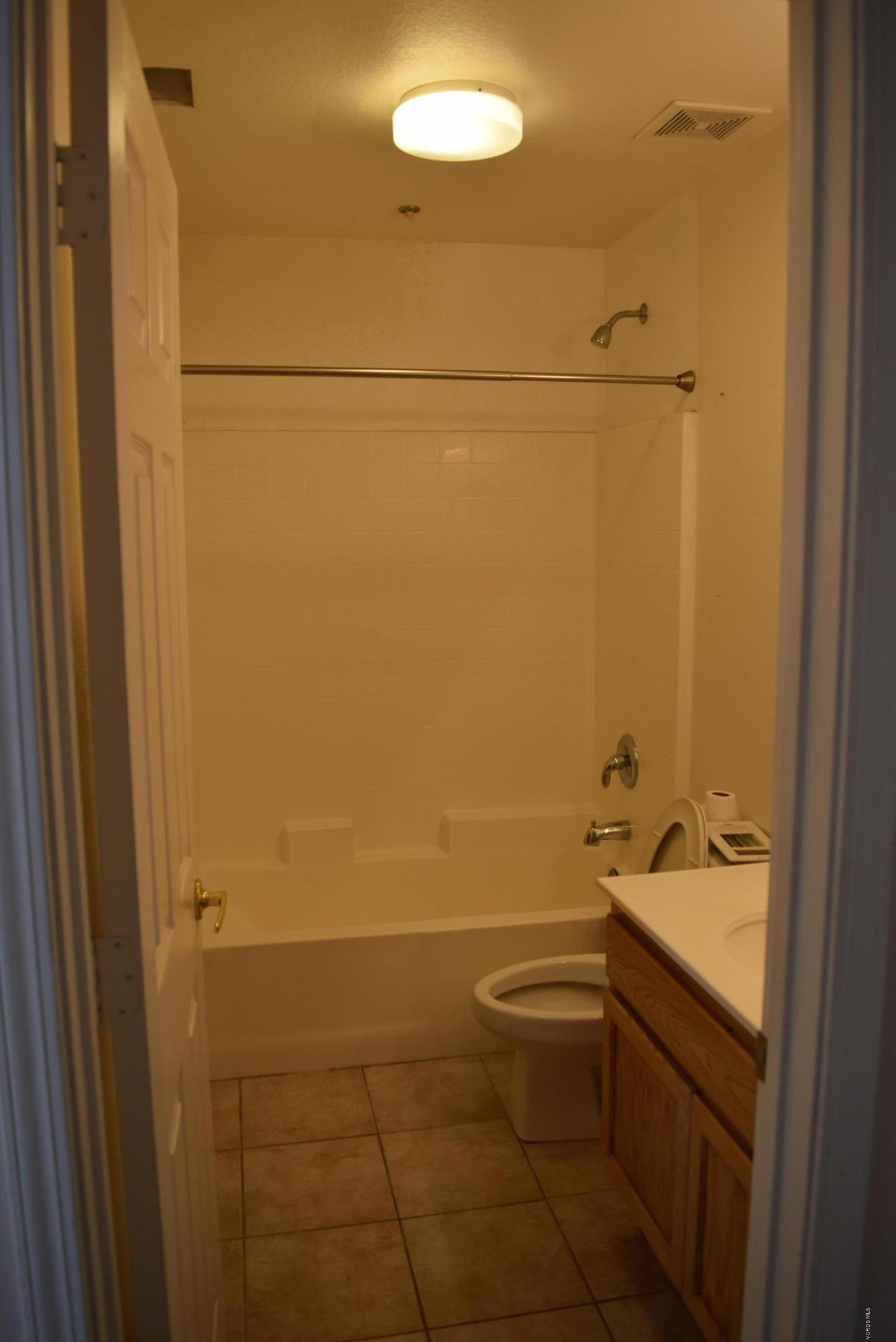 540 Ribbon Beach Way, Unit 296 Oceanside, CA 92058 - Photo 10 of 28 a bathroom with a sink and toilet