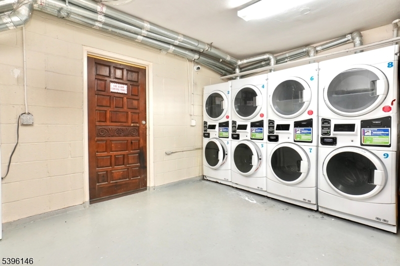 114 32nd Street, Unit 30 Union City, NJ 07087 - Photo 14 of 20 a utility room with dryer and washer