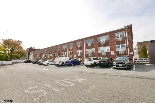 a view of street with parked cars
