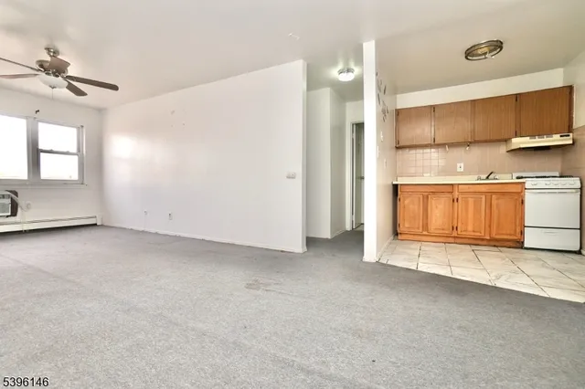 a view of a kitchen with a sink and dishwasher cabinets