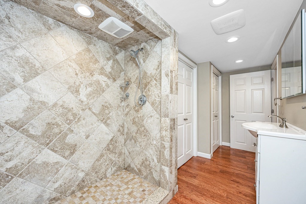 23 Lane Road Pelham, NH 03076 - Photo 20 of 42 a bathroom with a sink and a mirror
