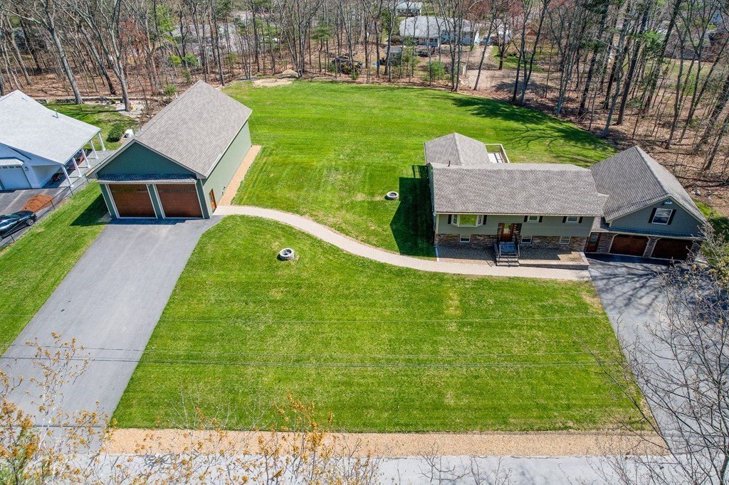 23 Lane Road Pelham, NH 03076 - Photo 3 of 42 a view of house with a yard and trees