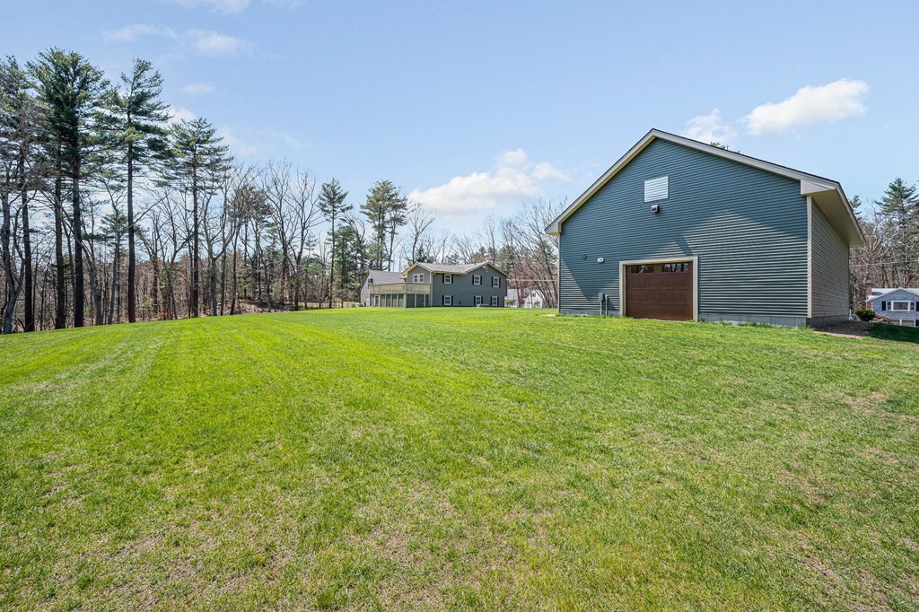 23 Lane Road Pelham, NH 03076 - Photo 41 of 42 a view of a house with a yard
