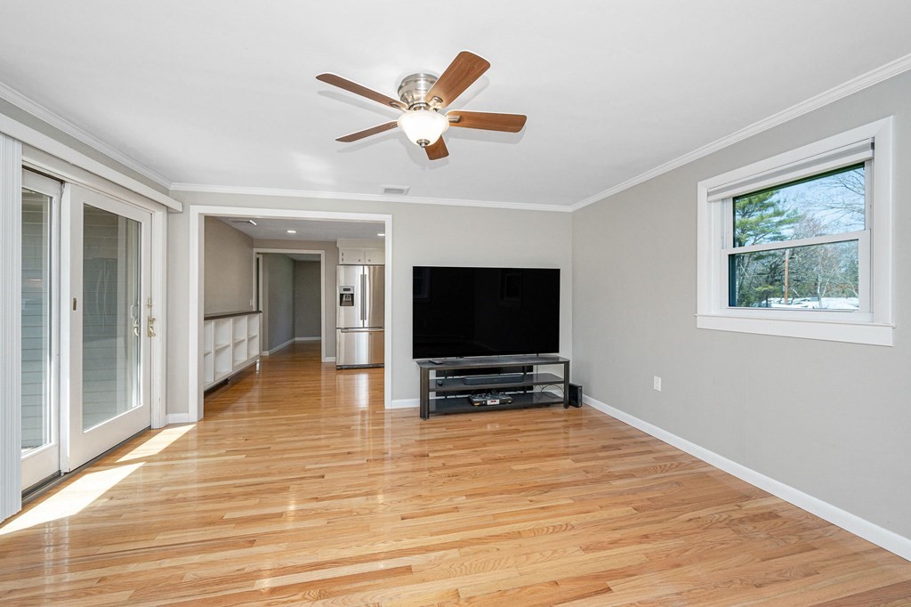 23 Lane Road Pelham, NH 03076 - Photo 9 of 42 a view of living room with wooden floor and windows