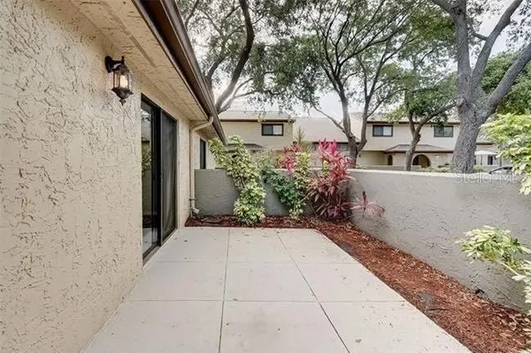a front view of a house with plants