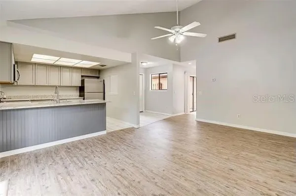 a kitchen with a sink and a refrigerator