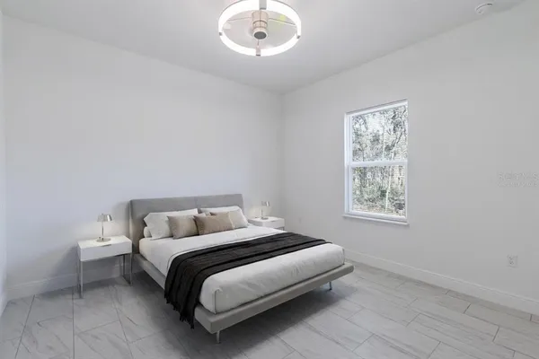 a view of a room with a tub and wooden floor