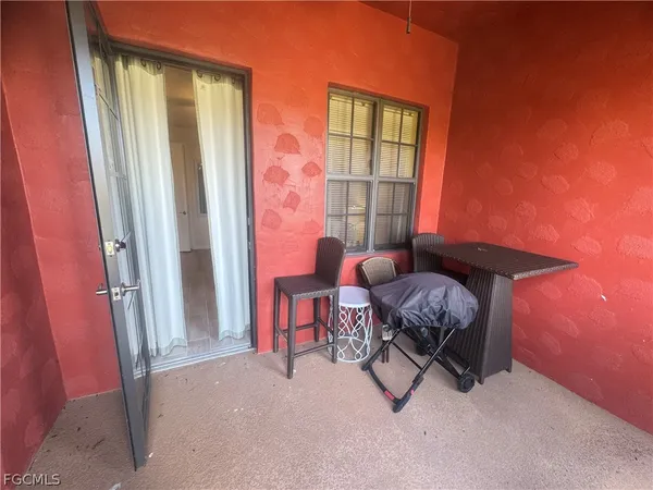 a outdoor living space with furniture and a window