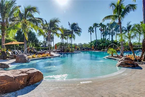 a view of a swimming pool and lounge chair